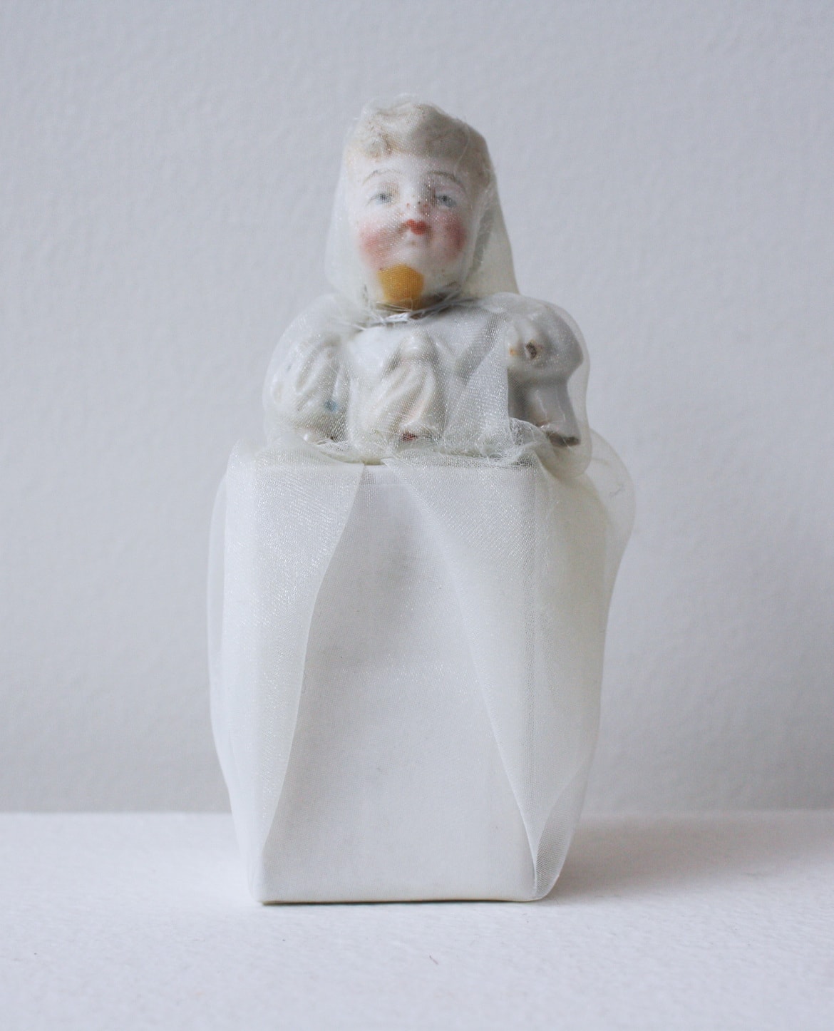 ‘Renovated three girls’, 2013, ceramic doll, Italian synthetic cloth, Japanese silk thread, 10 x 4 x 4 cm