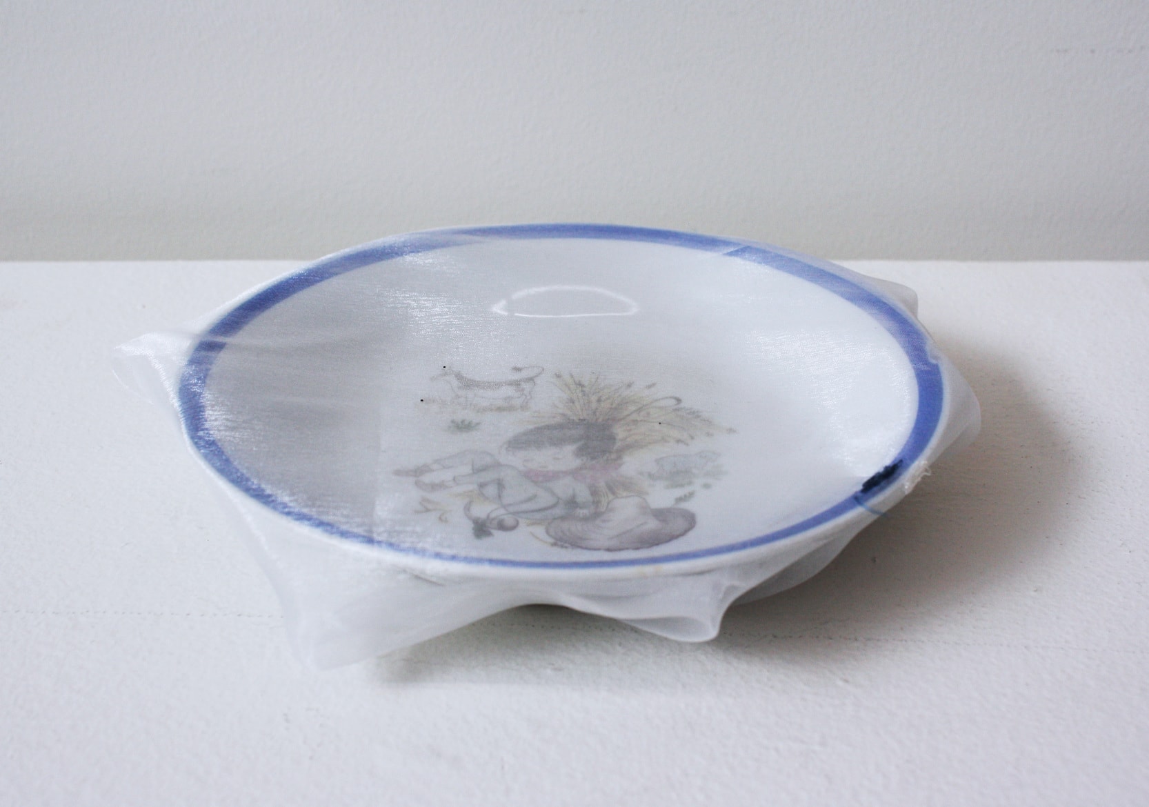 ‘Renovated soup plate for kids’, 2012, ceramic dish, Italian synthetic cloth, Japanese silk thread, 3H x 18D cm