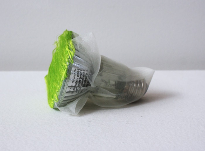‘Green light bulb’, 2015, light bulb, Italian synthetic cloth, Japanese silk thread, 8H x 8D cm