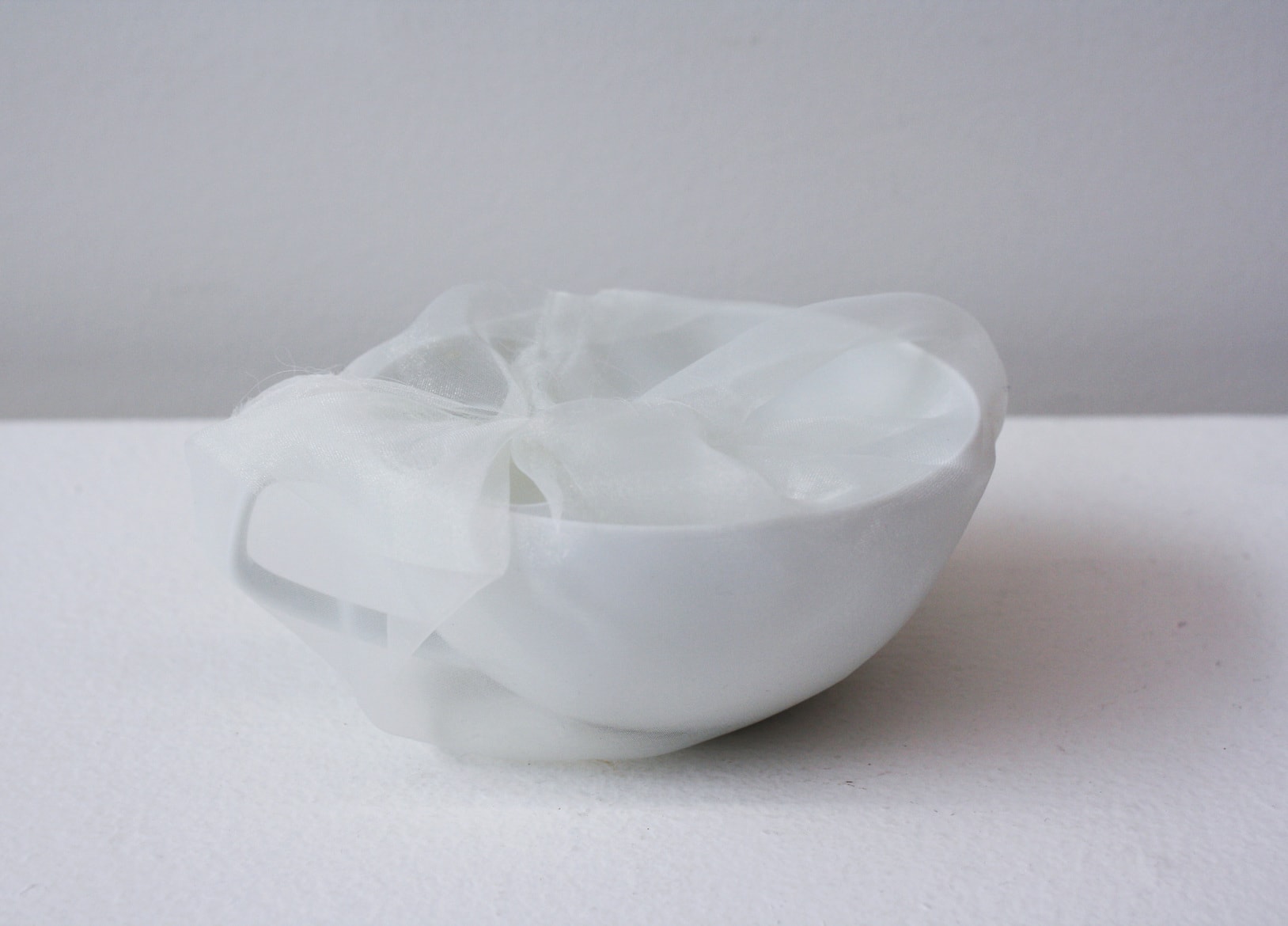 ‘Renovated teacup (Rosenthal white)’, 2014, ceramic cup, Italian synthetic cloth, Japanese silk thread, 10H x 4D