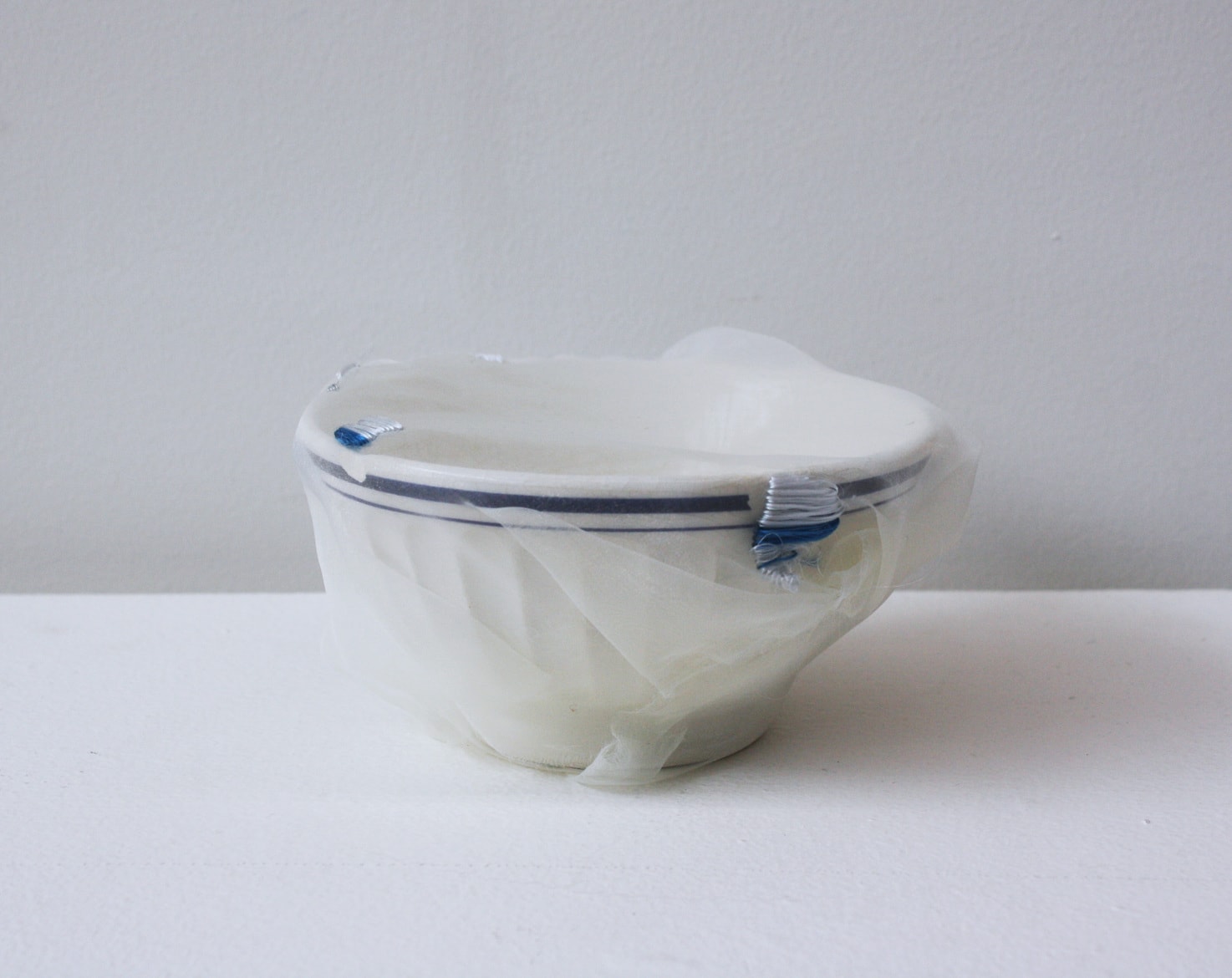 ‘R.D's renovated café au lait bowl with blue lines’, 2012, ceramic bowl, Italian synthetic cloth, Japanese silk thread,  7H x 15D