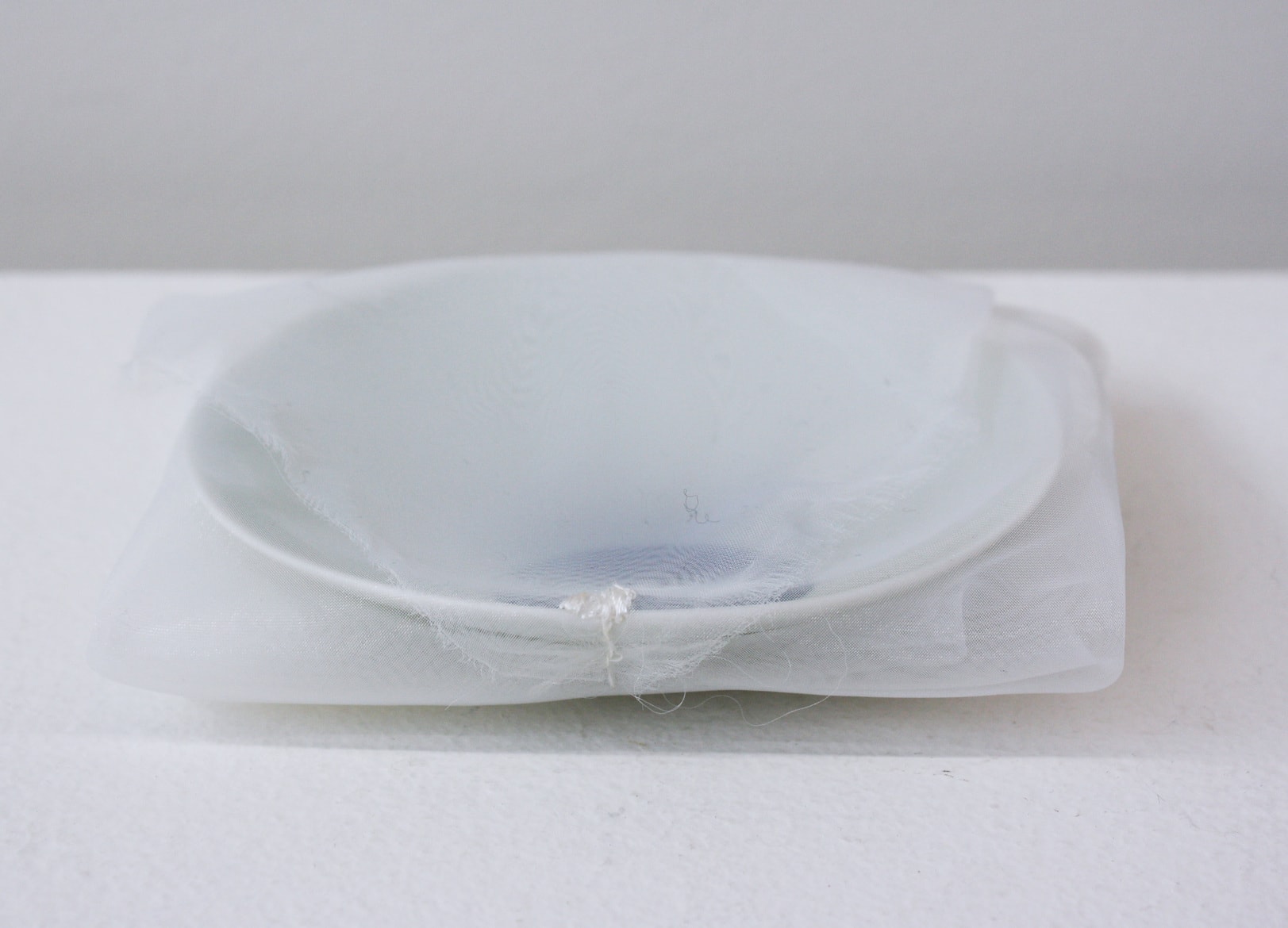 ‘Blue moon plate’, 2004, ceramic plate, Italian synthetic cloth, Japanese silk thread, 2H x 11D
