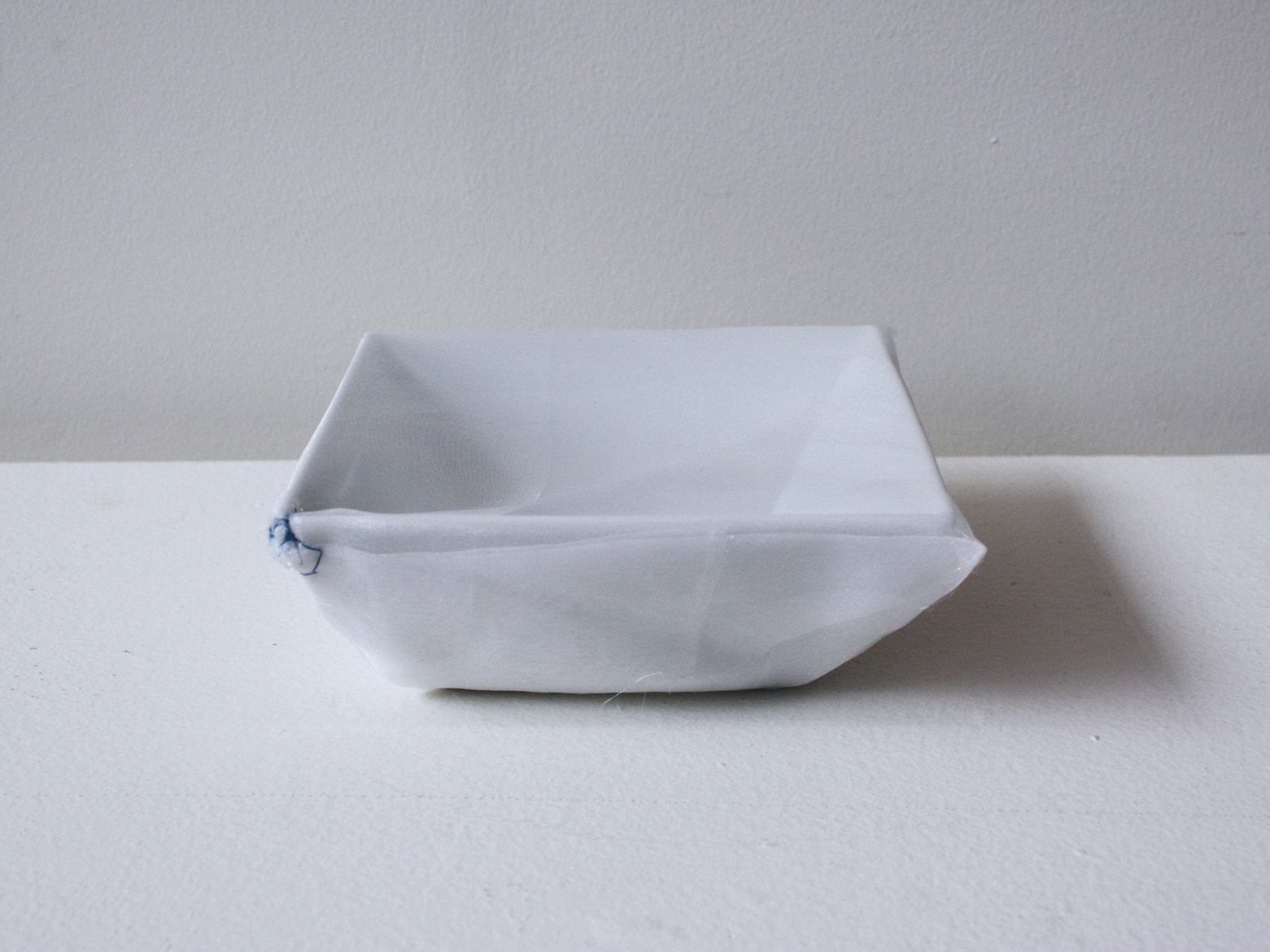 ‘K.K.'s square dish’, 2007, ceramic bowl, Italian synthetic cloth, Japanese silk thread, 15 x 15 x 4 cm
