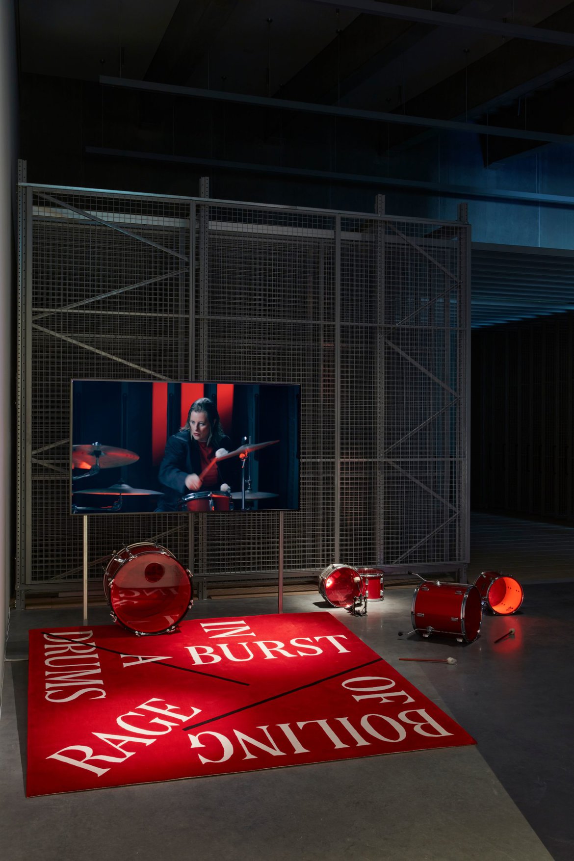 ‘A Burst of Boiling Rage (Installation)’, 2021-2022, Rug (designed with Elliott Bryce Foulkes), Drum kit, screen, POA